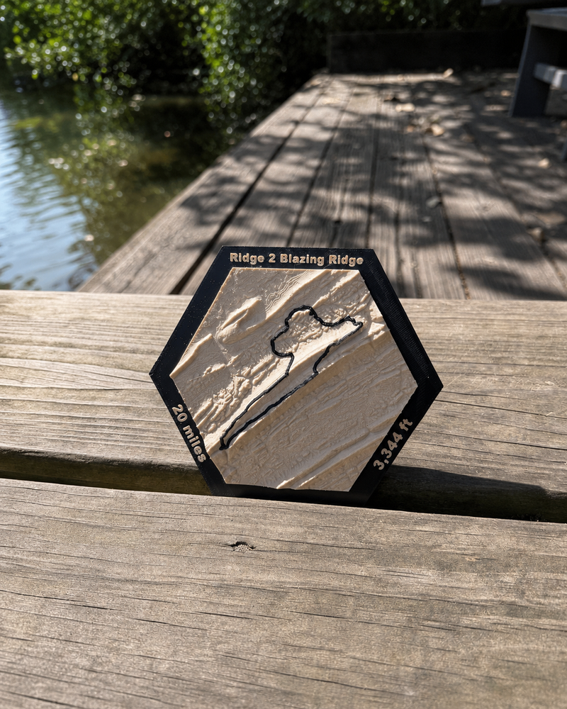 Ridge to Blazing Ridge 20-mile 3D topographic race map displayed outdoors
